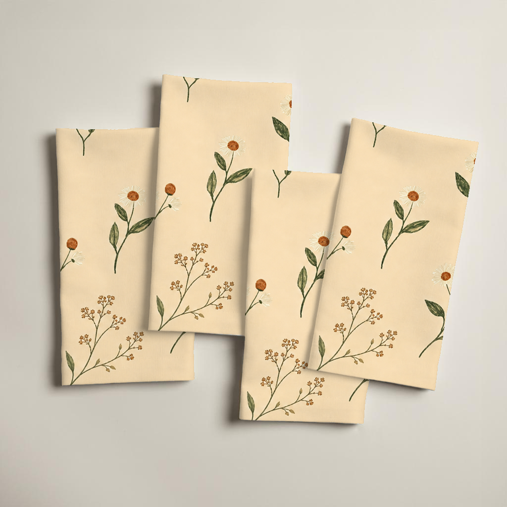 Aurelia set of four linen napkins with ivory flowers and olive stems on butter yellow.