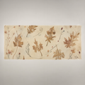 Coppice Fine Cotton tablecloth, folded horizontal view showing chestnut oak leaves on parchment.