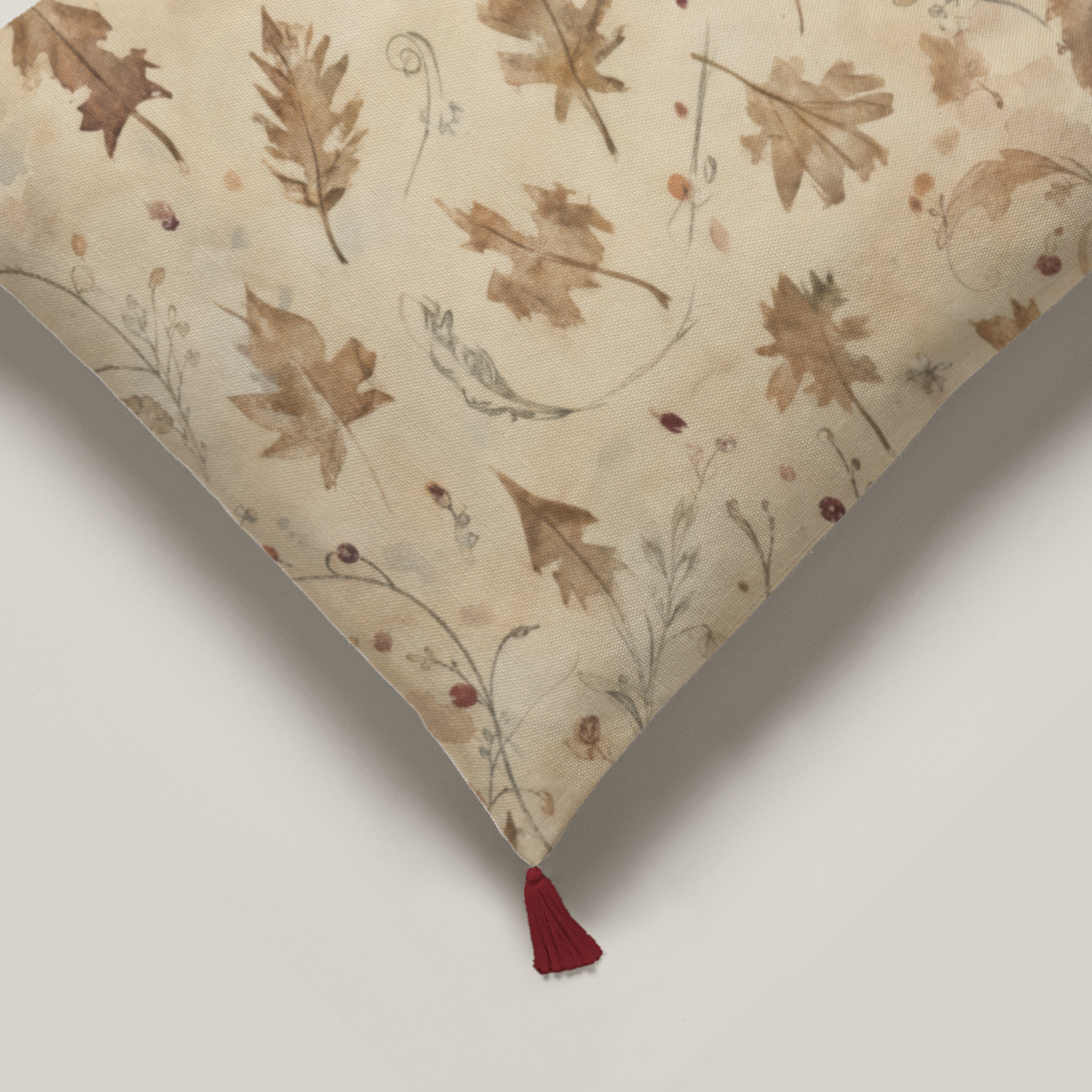 Coppice Fine Cotton pillow cover, close-up of botanical print and a deep red corner tassel.