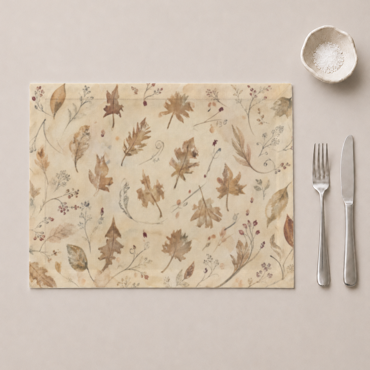 Coppice Crisp Linen placemat styled beside tableware; cutlery and bowl are styling only.