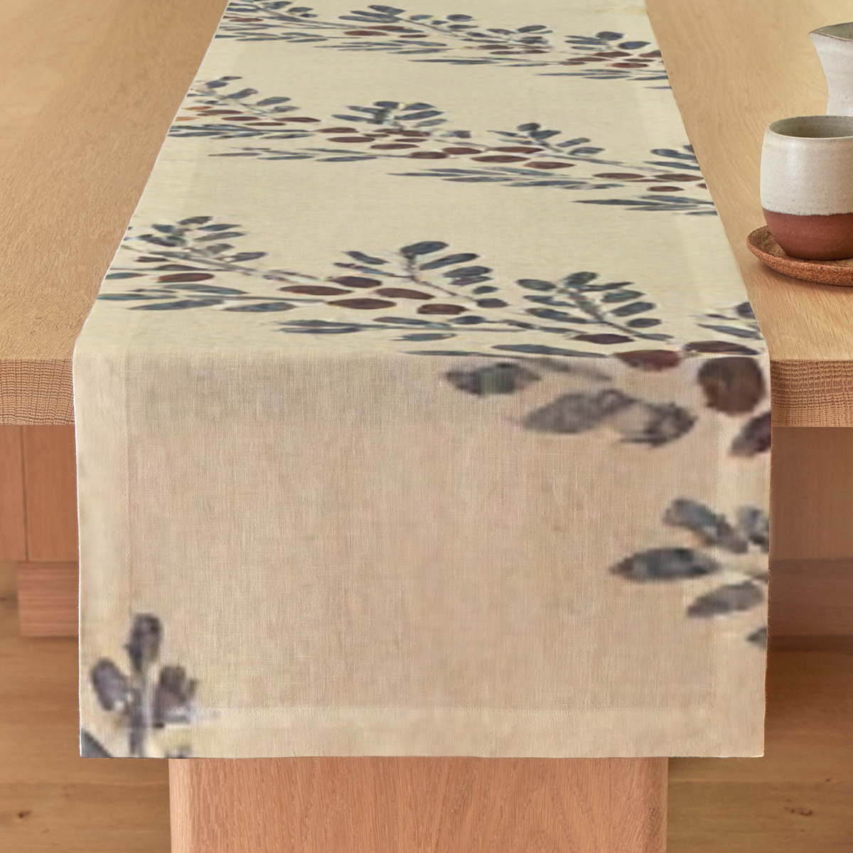 Sorbier Botanical Cotton Sateen Table Runner — 18 × 120″; runner draped across a dining table; tableware is styling only.