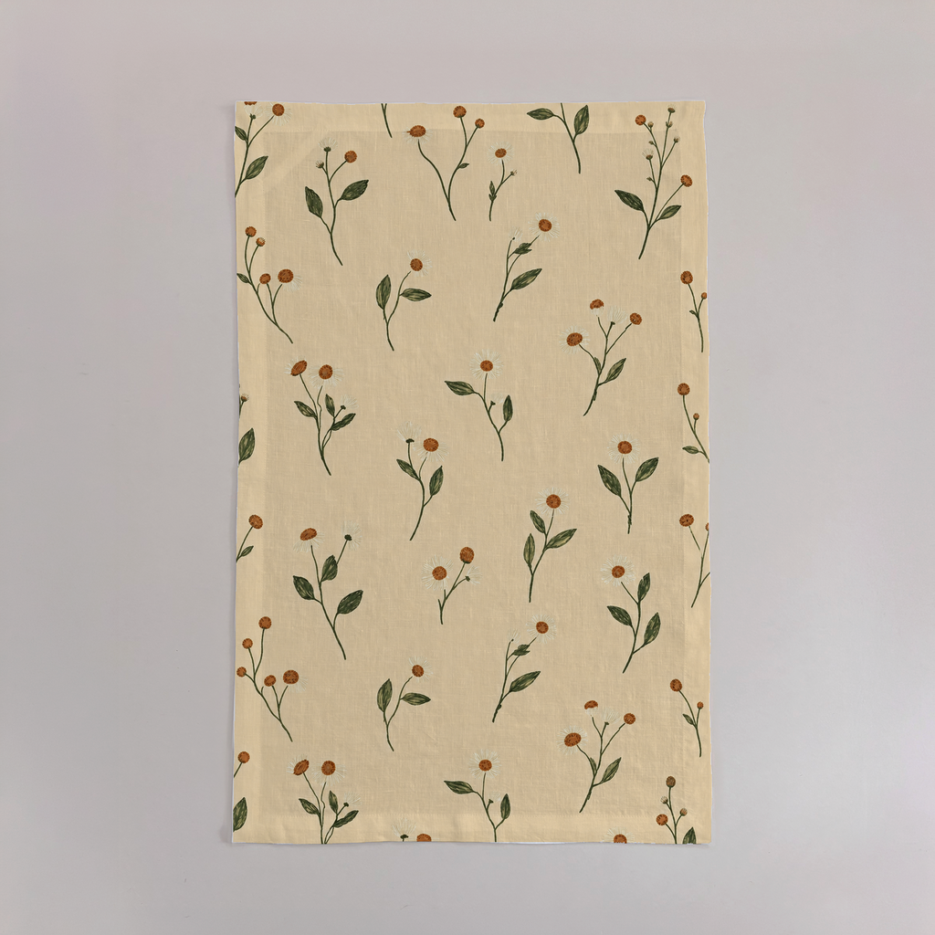 Aurelia Crisp Linen tea towels with butter-yellow ground and olive botanical stems; sold as a set of two; one towel shown flat.
