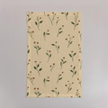 Aurelia Crisp Linen tea towels with butter-yellow ground and olive botanical stems; sold as a set of two; one towel shown flat.