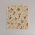 Coppice Fine Flatweave tea towels with chestnut oak leaves on parchment; sold as a set of two; one towel shown flat.